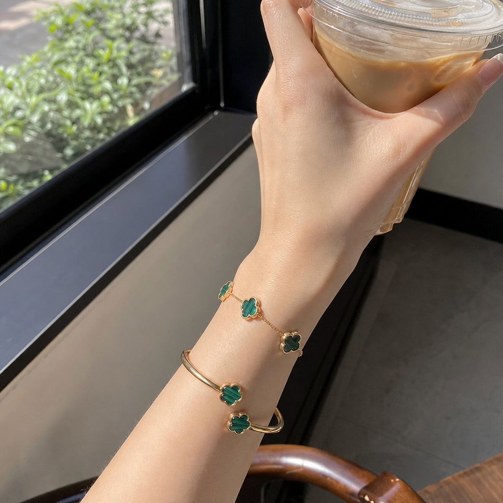 Green clover bracelet and bangle worn stacked, gold finish