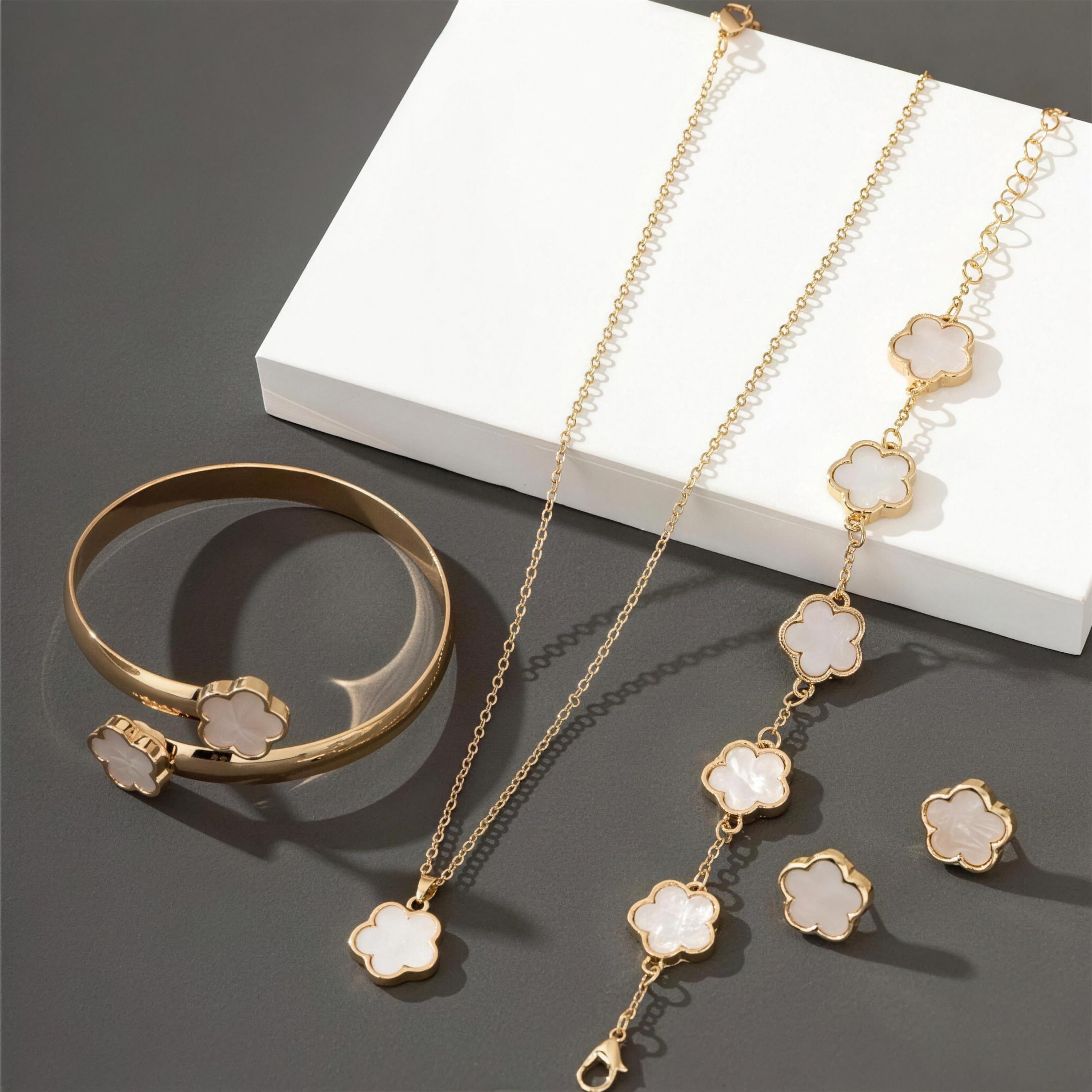 Lucky Clover Jewels 4-Piece Set in White, gold clover necklace, bracelet, bangle and stud earrings