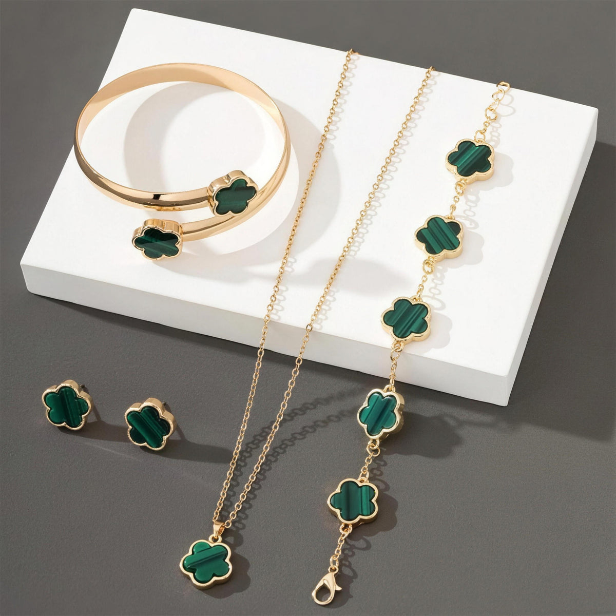 Lucky Clover Jewels 4-Piece Set in Green, gold clover necklace, bracelet, bangle and stud earrings